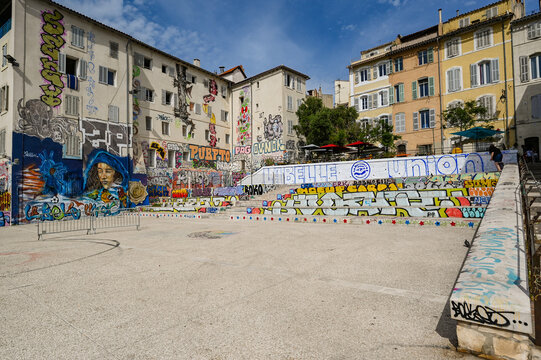 Marseille, France - June 8, 2024: Colorful murals adorn the narrow, hilly streets of historic Le Panier, High quality photo