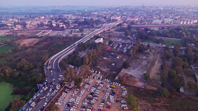 Traffic jam in ayodhya dham road with Tedhi Bazar Railway Overbridge at day time, push in, drone shot, 4k.