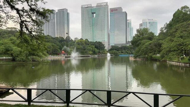 Perdana Botanical Garden view of skyscrapers buildings in kuala lumpur capital city kl malaysia