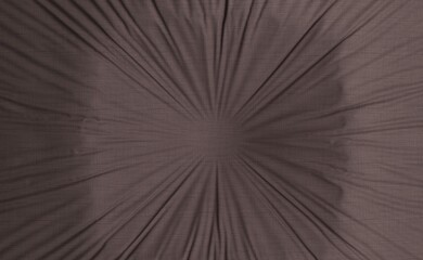 Abstract radial pattern on a textured fabric