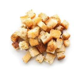 Pile of crunchy croutons with spices isolated on white background, top view