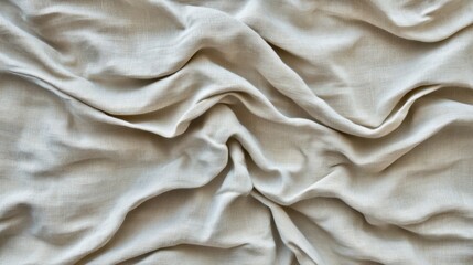 Obraz premium Wrinkled taupe cotton fabric with organic creases and minimal lighting