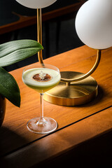 Elegant Green Cocktail Aromatic Garnish Gold Accent Modern Still Life