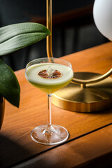 Elegant Green Cocktail Delicate Garnish Chic Glassware Soft Lighting