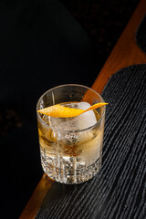 Golden Hour Cocktail Amber Spirit Ice Cube and Citrus Twist