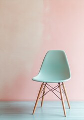 Light mint chair against soft pink wall