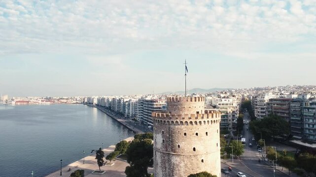 Drone shot of White Tower of Thessaloniki with no people at morning.