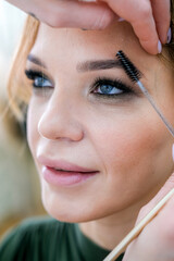 close up eyes Makeup, Make up in process , beautician applies makeup eyeshadows in bright...