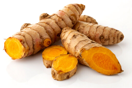 Fresh Turmeric Rhizomes (Curcuma longa L.) on White Background &ndash; Vibrant & Organic