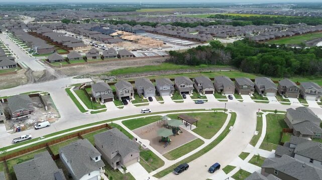 Master planned community northern edge of Highway 380 in Princeton, Texas with Lake Lavon in background, new construction houses upscale neighborhood children playground, building projects flyover