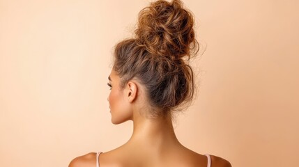 This image features a beautiful woman with a high bun hairstyle, emphasizing the elegant and stylish look that enhances her natural beauty and graceful posture.
