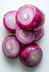 Fresh Red Onions Sliced and Stacked in a Creative Arrangement for Culinary Use and Food Photography on Bright Background