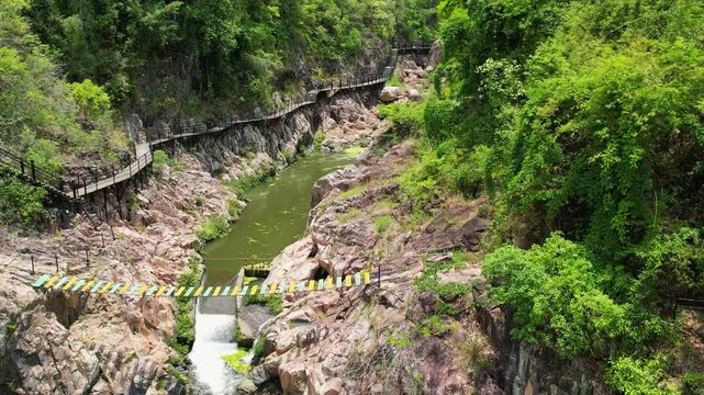 Top view of the river in the canyon in the center of Hainan Island, China. The wildlife of the island. A national park in China.