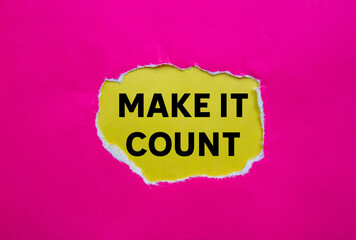 Make it count message written on ripped torn pink paper on yellow background. Conceptual make it count symbol. Copy space.