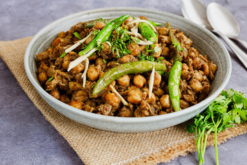 Chickpea Masala Garnished with Green Chillies, Ginger and Cilantro, Indian Vegetarian Food Photography
