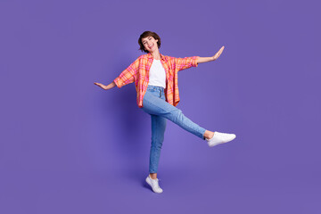Full body portrait of pretty young lady dancing partying wear shirt isolated on purple color background