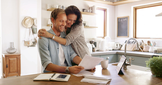 Home, hug and couple with documents, smile and payment for mortgage, rent and love. Apartment, finance and man with woman in kitchen, embrace and paperwork report for savings and investment growth