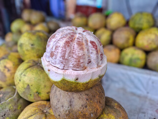 pile of grapefruit or pomelo or jeruk bali