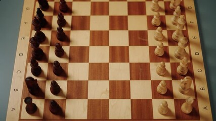 Chess match preparation with timers and pieces on the board in a cozy indoor setting