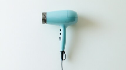 Fototapeta premium Light teal-colored hair dryer on white background