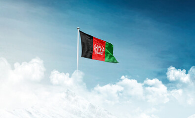 Afghanistan national flag with mast waving in beautiful sky. Afghanistan flag for Republic Day and Independence Day.