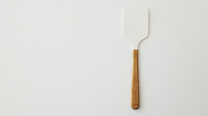 Simple white spatula with a light brown wooden handle