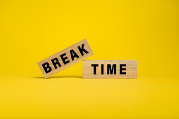 break time words text on wooden blocks isolated on yellow background