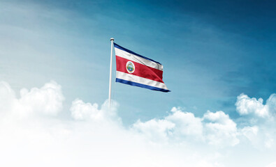 Costa Rica national flag with mast waving in beautiful sky. Costa Rica flag for Republic Day and...