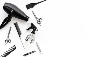 Barbershop tools set on white background - combs and scissors, top view