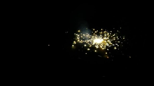 fireworks on the ground. Exploding Firecracker at Night on Grass