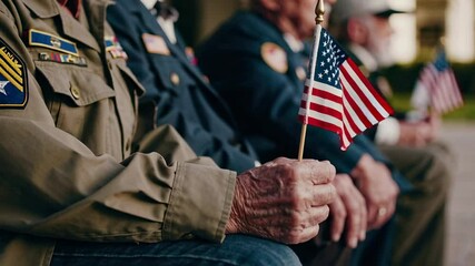 Weathered hands of senior military veterans proudly gripping miniature american flags during solemn memorial service, symbolizing profound patriotic respect and national remembrance - Powered by Adobe
