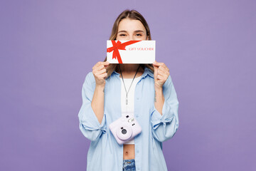 Traveler woman in blue clothes hold cover mouth gift coupon voucher card for store isolated on...