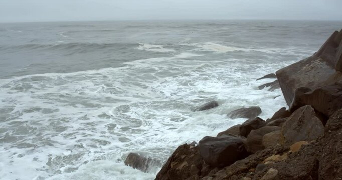 Closeup on Waves Crashing Against Breakwater Boulders | Powerful Ocean Motion