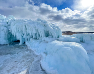 A large ice formation with a blue sky in the background