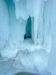 A large ice formation with a blue sky in the background