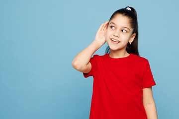Little kid girl 8-9 years old wear red t-shirt have fun try to hear you overhear listening intently...