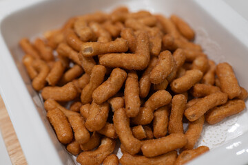 Crispy Savory Snacks in White Square Plate, Perfect for Relaxing Moments