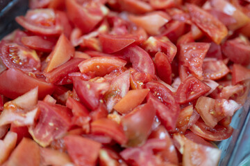 Fresh Chopped Tomato Pieces in Clear Container Ready for Cooking or Salad