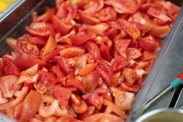 Fresh Chopped Tomato Pieces in Clear Container Ready for Cooking or Salad