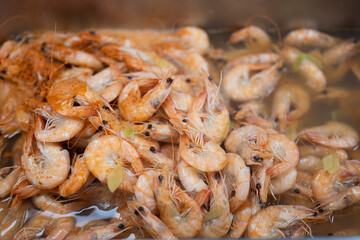 Cooked Shrimp in Hot Broth with Herbs and Steam Rising