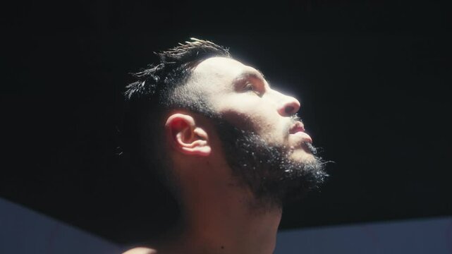 Pensive Man Looking Toward Light