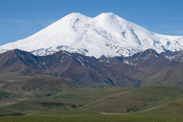 Fototapeta premium Mount Elbrus close-up on a sunny June day. Kabardino-Balkaria, Russia