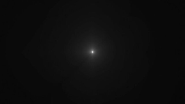 abstract light rays motion background. white gray Centered Light Ray Lens Flare Loop 4k animation. volumetric light effect, optical lens flare effect animation. light beams.