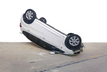 Damaged car after crash overturned on the road in daytime. Car accident White background.