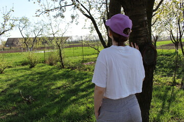 young girl standing in the garden outdoors