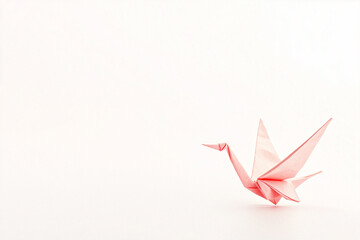 Obraz premium Delicate Origami Crane Centered on a Soft Minimal Background
