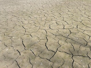 Cracked mud textured abstract background. Dry cracked ground background wallpaper. dry cracked mud...