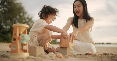 Joyful mother and child sharing a playful moment at the beach. A heartwarming scene full of laughter and love, perfect for parenting, family, and lifestyle storytelling content.