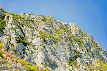 Mountainous landscape with a dam on the edge of the lake. Bovilla Lake - Albania