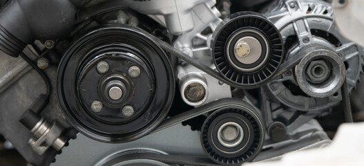 Close-up View of a Car Timing Belt and Pulleys Showcasing Mechanical Components Under the Hood
